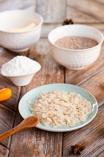 High angle of cake ingredients with wooden spoon