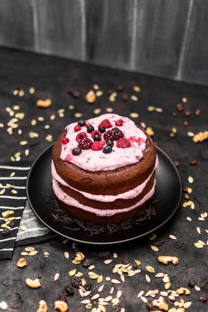 High angle of cake on plate with nuts