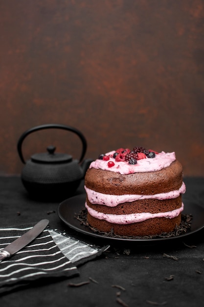 High angle of cake with copy space and tea pot