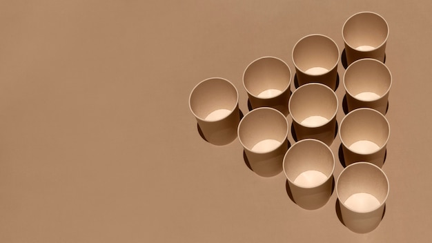 High angle cardboard cups with copy space