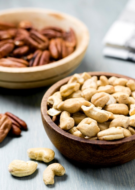 High angle of cashews and walnuts in bowls