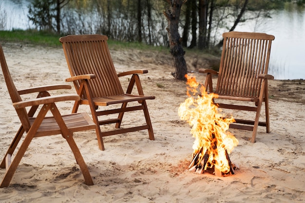 High angle chairs around bonfire