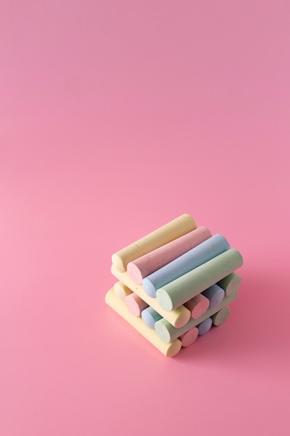 High angle of chalk arrangement on plain background