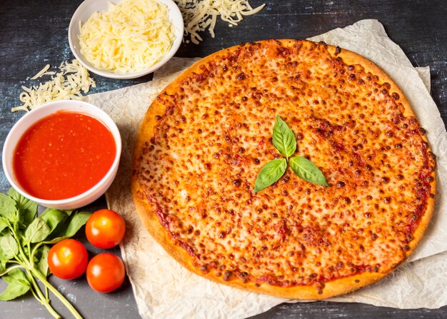 High angle cheese pizza with tomato sauce and mozzarella