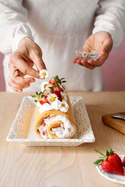 high angle chef decorating cake