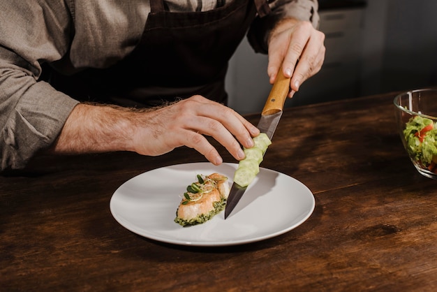 High angle chef plating meal