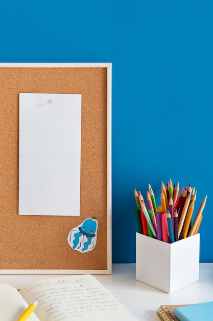 High angle of children's desk with colorful pencils