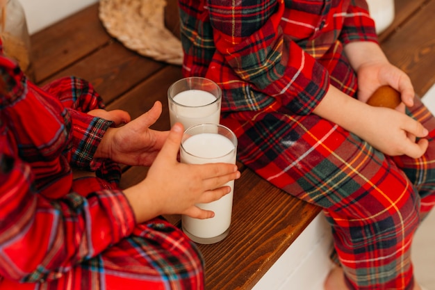 High angle children wanting to drink milk