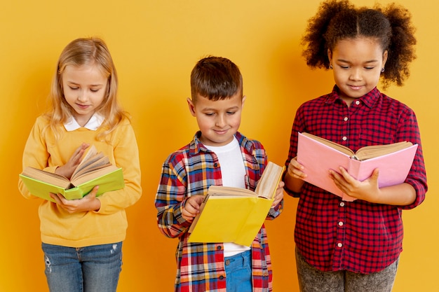 High angle childrens with books reading