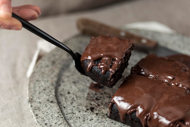 High angle of chocolate cake piece on fork