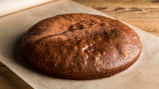 High angle chocolate cake with cocoa powder