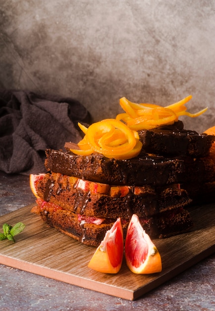 Free photo high angle of chocolate cake with fruit and mint