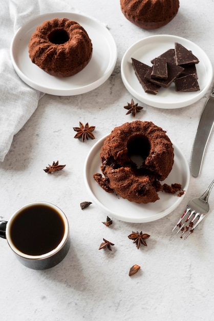 High angle chocolate cake with star anise and coffee