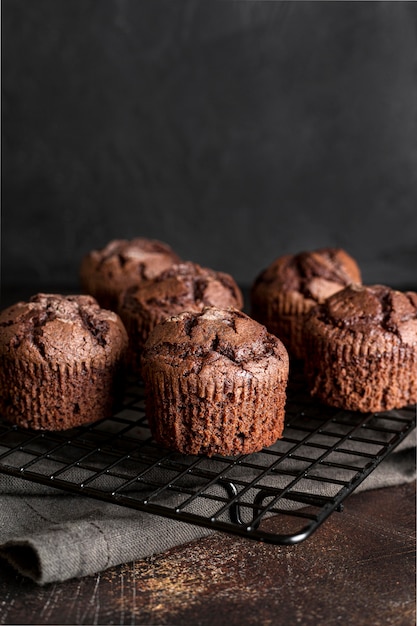 High angle of chocolate muffins on cooling rack with copy space