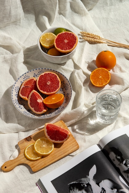 Free photo high angle citrus on white cloth