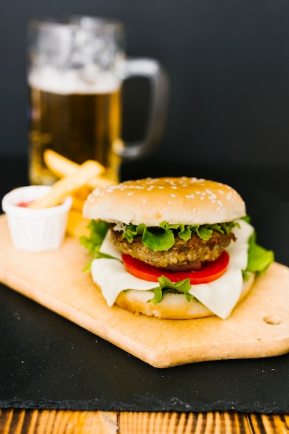 High angle close-up burger with fries on plate