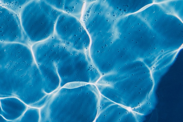 High angle closeup shot of a crystal clear swimming pool water