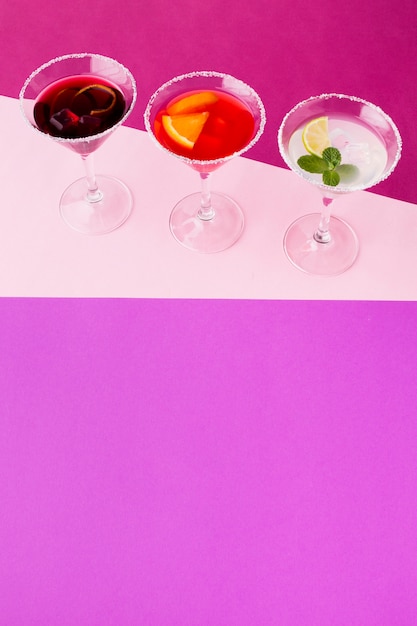 Free photo high angle of cocktail glasses with copy space