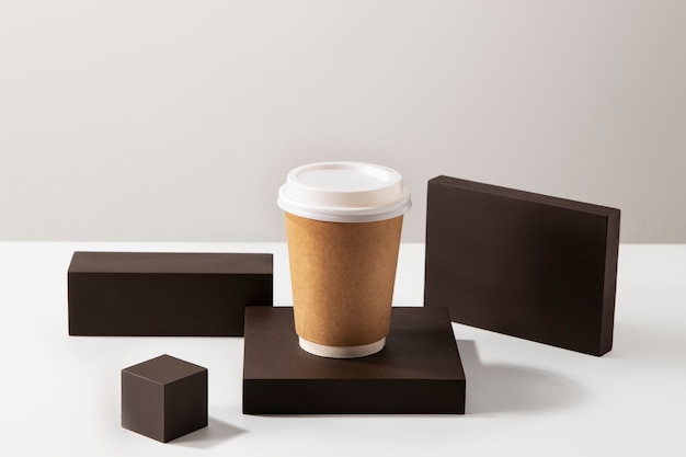 Free photo high angle coffee cup with wooden boards