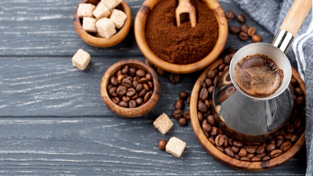 High angle of coffee on wooden table