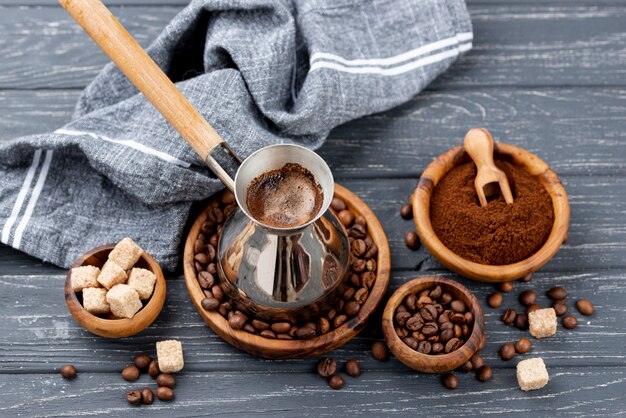 High angle of coffee on wooden table