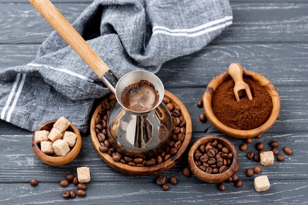 High angle of coffee on wooden table