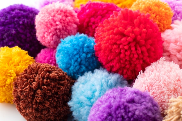 Free photo high angle colorful pom poms arrangement