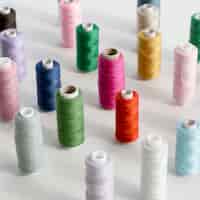 Free photo high angle of colorful thread rolls