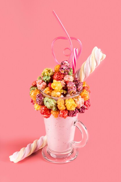 High angle of colorful topping on dessert in glass