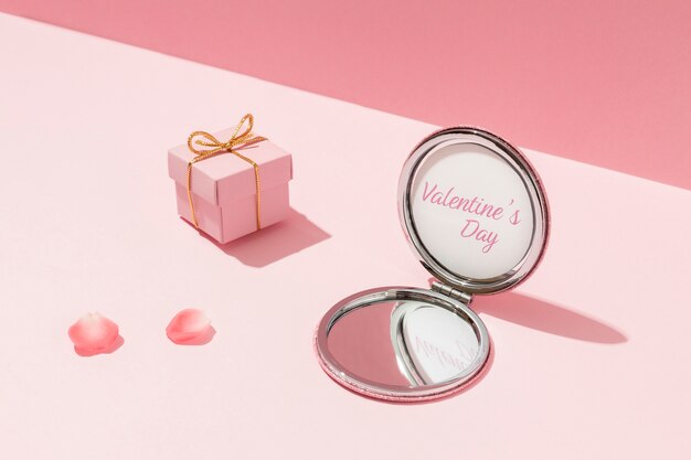 High angle of compact mirror for valentines day with gift box