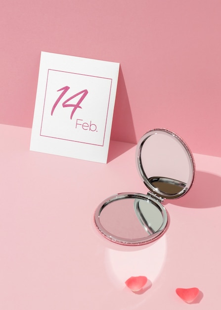 Free photo high angle of compact mirror for valentines day