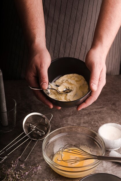 High angle of cook showing mixture in bowl