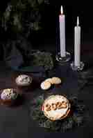 Free photo high angle cookies and candles arrangement