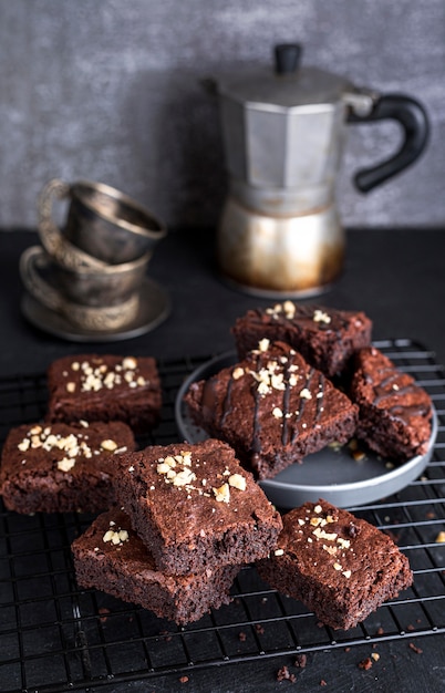 High angle of cooling rack with brownies and kettle