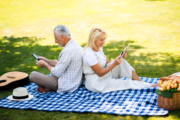 High angle couple checking their devices