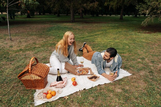 High angle couple having a picnic together