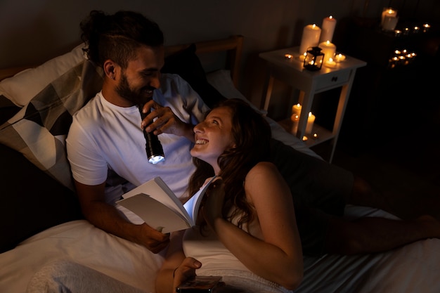 High angle couple laying in bed