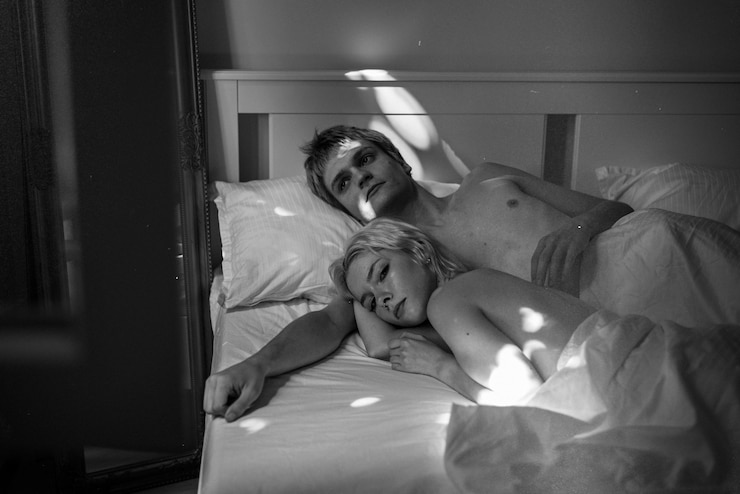 Free Photo high angle couple laying in bed