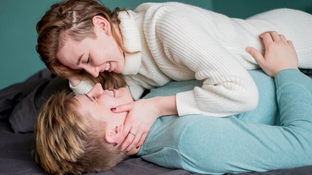 High angle couple sitting on couch