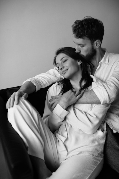 High angle couple sitting on couch