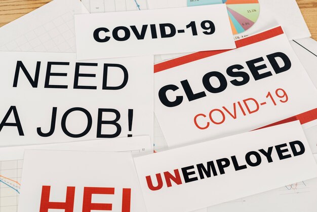 High angle covid19 and unemployment signs