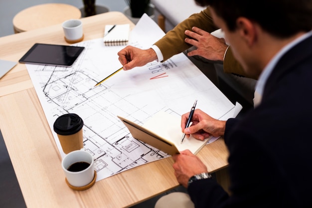 High angle coworkers planning together at office