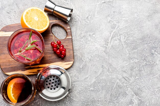 High angle cranberry vodka on cutting board with copy-space