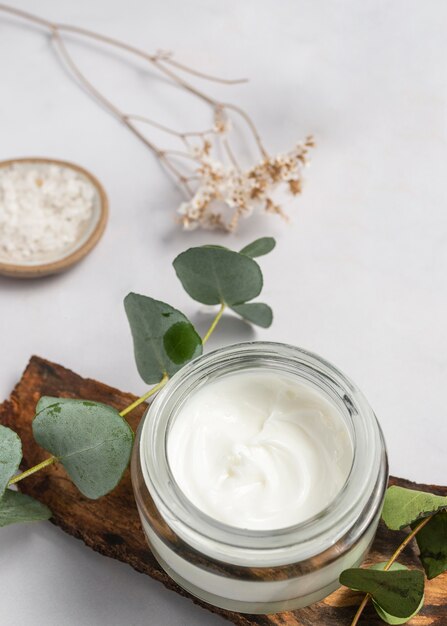 High angle cream container and plant