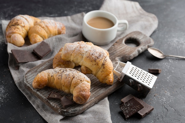 High angle croissant with coffee