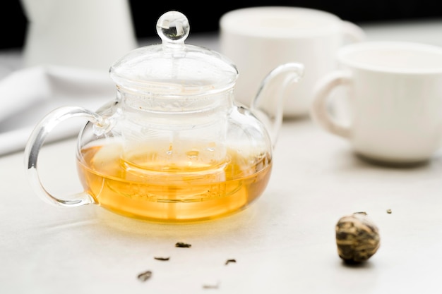 Free photo high angle crystal teapot with dried plant