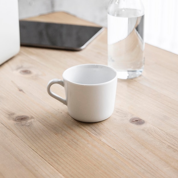 High angle cup and glass on table