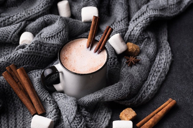 High angle cup of marshmallow drink with cinnamon