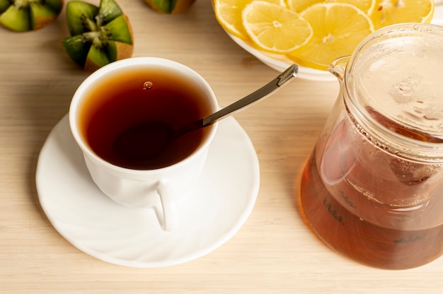 High angle cup of tea arrangement on plain background