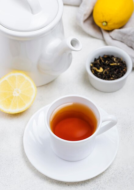 High angle cup with tea on desk